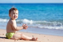 happy-toddler-on-sand-beach_1398-205